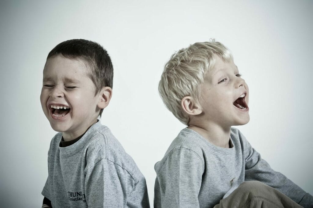 Students joyfully laughing together, promoting emotional well-being and connection