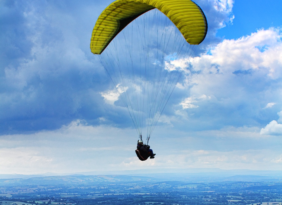 therapist flying with yellow parachute