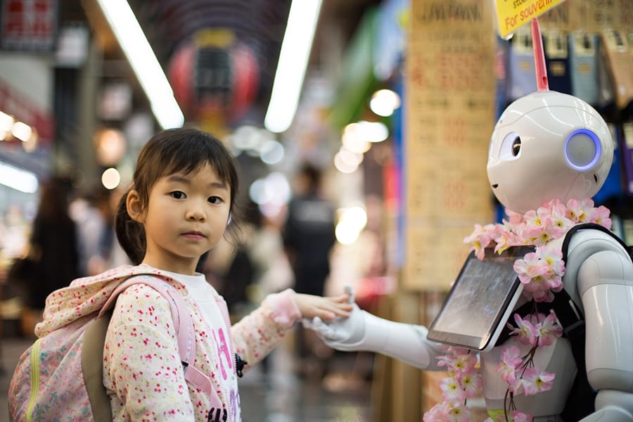 Child interacting with a speech therapy robot in a lively setting