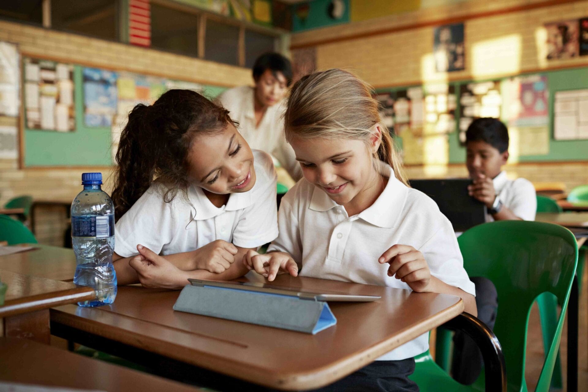 Two students working on a classroom assignment on an iPad together