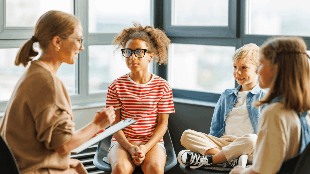 Therapist engaging with student in group therapy session