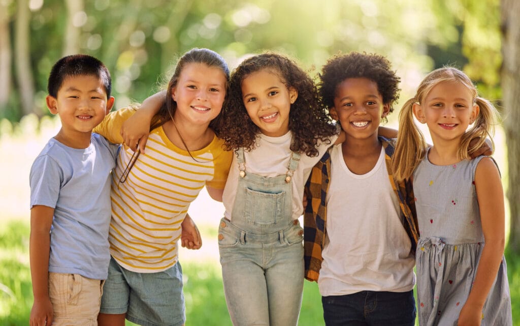 Group of elementary school student smiling outdoors