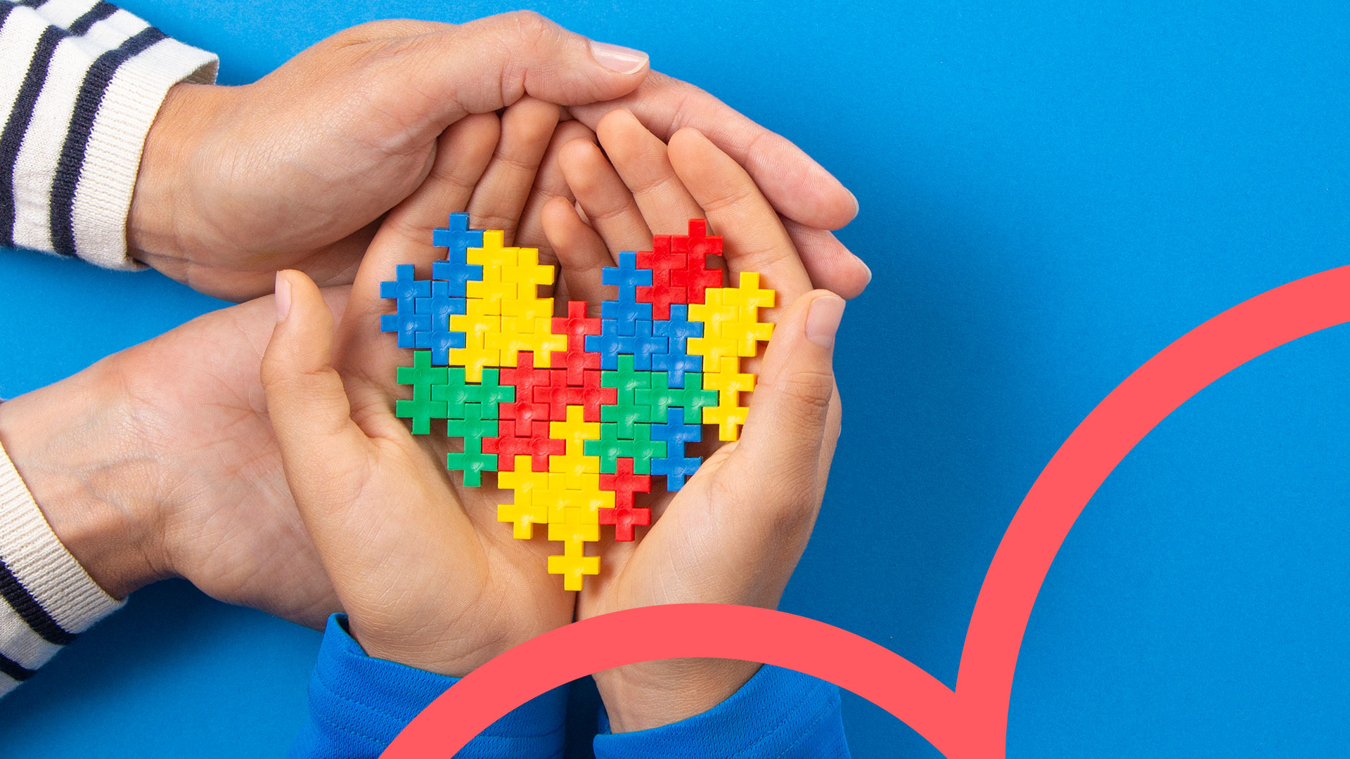 2 hands holding a puzzle heart