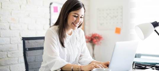 Smiling teletherapist engaged with online learning