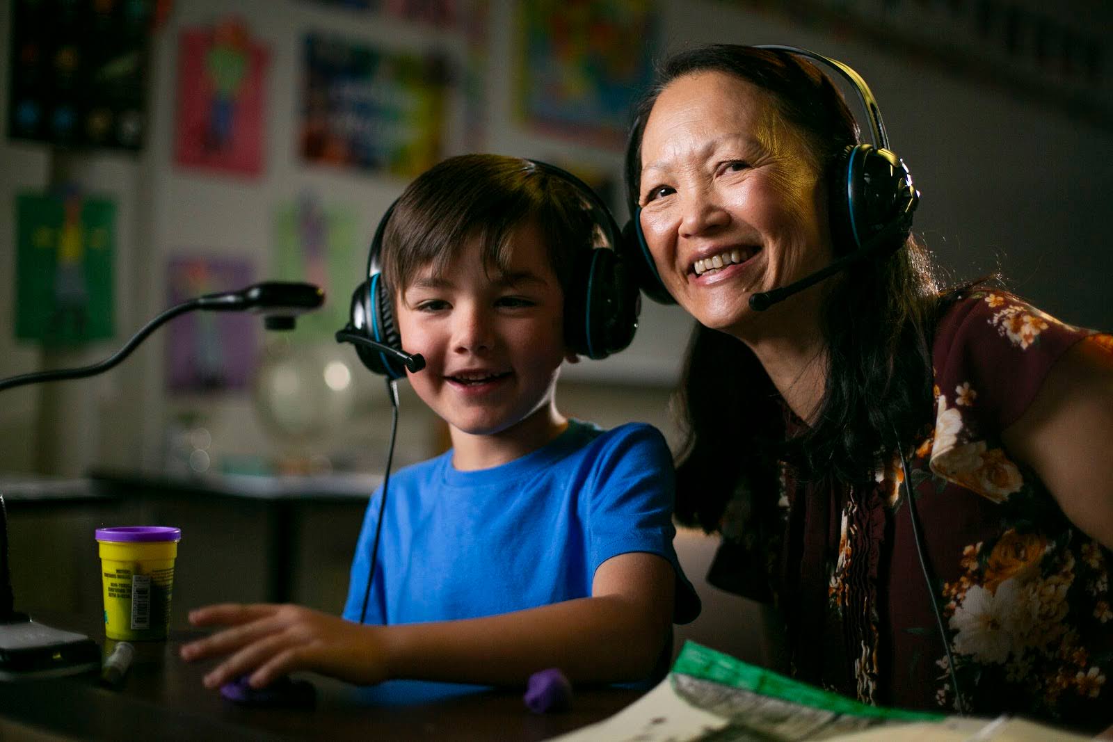Smiling teletherapist engaged with online learning