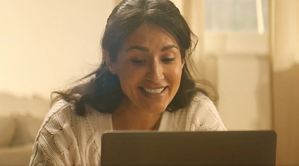 Smiling teletherapist engaged with online learning