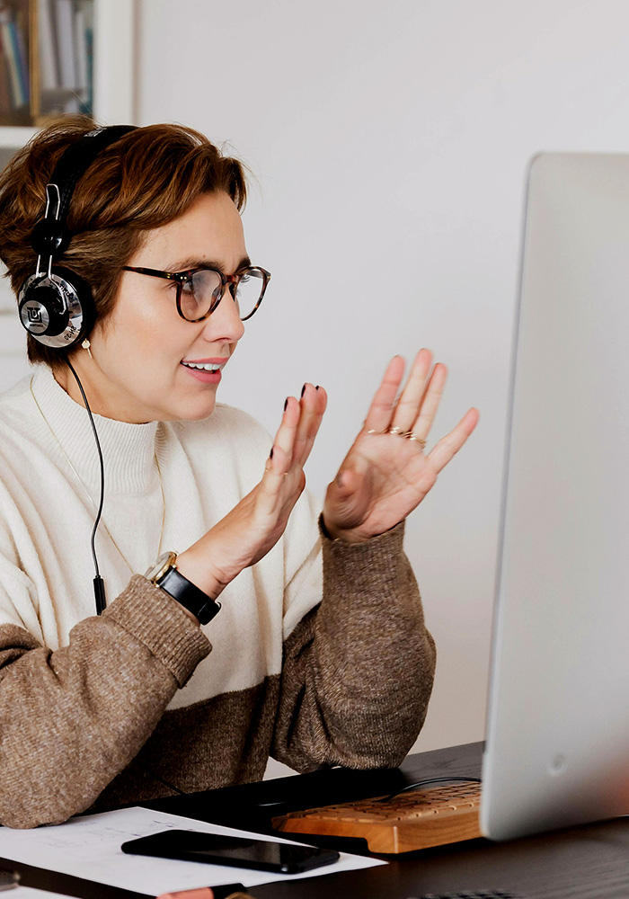 Smiling teletherapist engaged with online learning